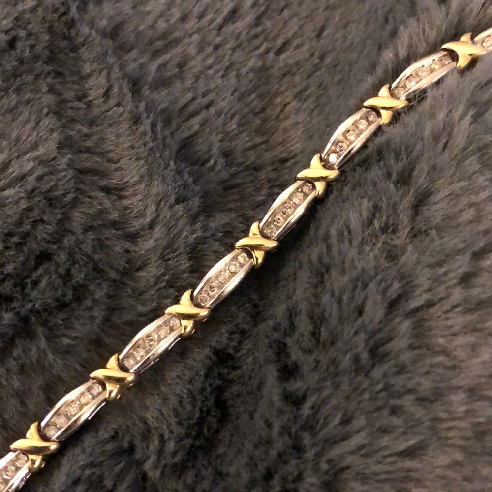 1 ct diamond, 7”, two-tone 10k gold bracelet.